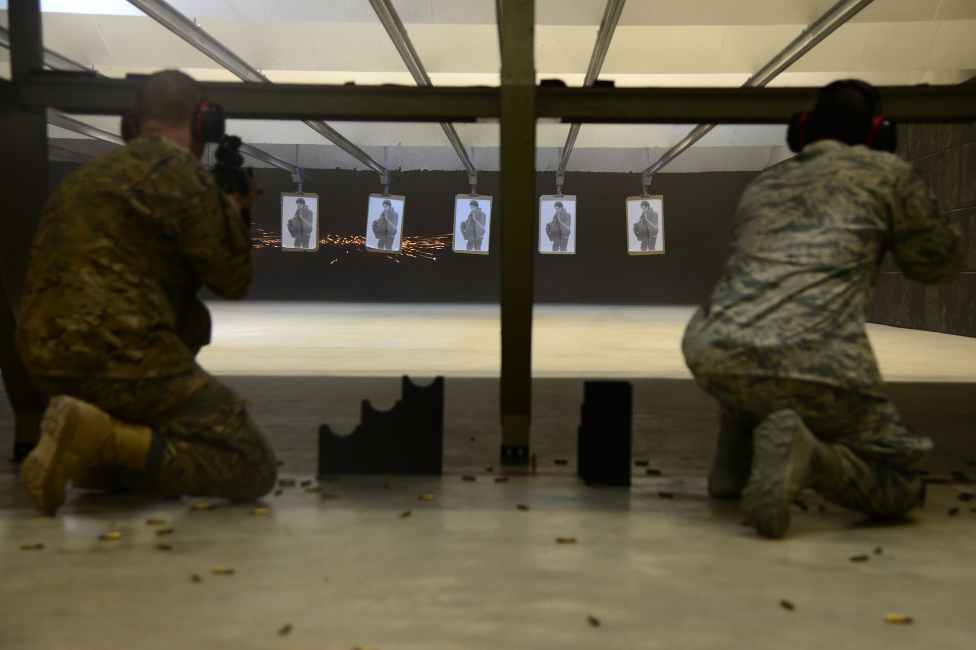 Servicemembers assigned to the Special Operations Command Central Forward, qualify on the M-4 carbine rifle at Al Udeid Air Base, Qatar, Oct. 15, 2014. Servicemembers are required to qualify prior to a deployment, and include being able to use the techniques from four stationary positions: lying down with a support, lying down without a support, kneeling with a support and standing behind a barricade. (U.S. Air Force photo by Staff Sgt. Ciara Wymbs)