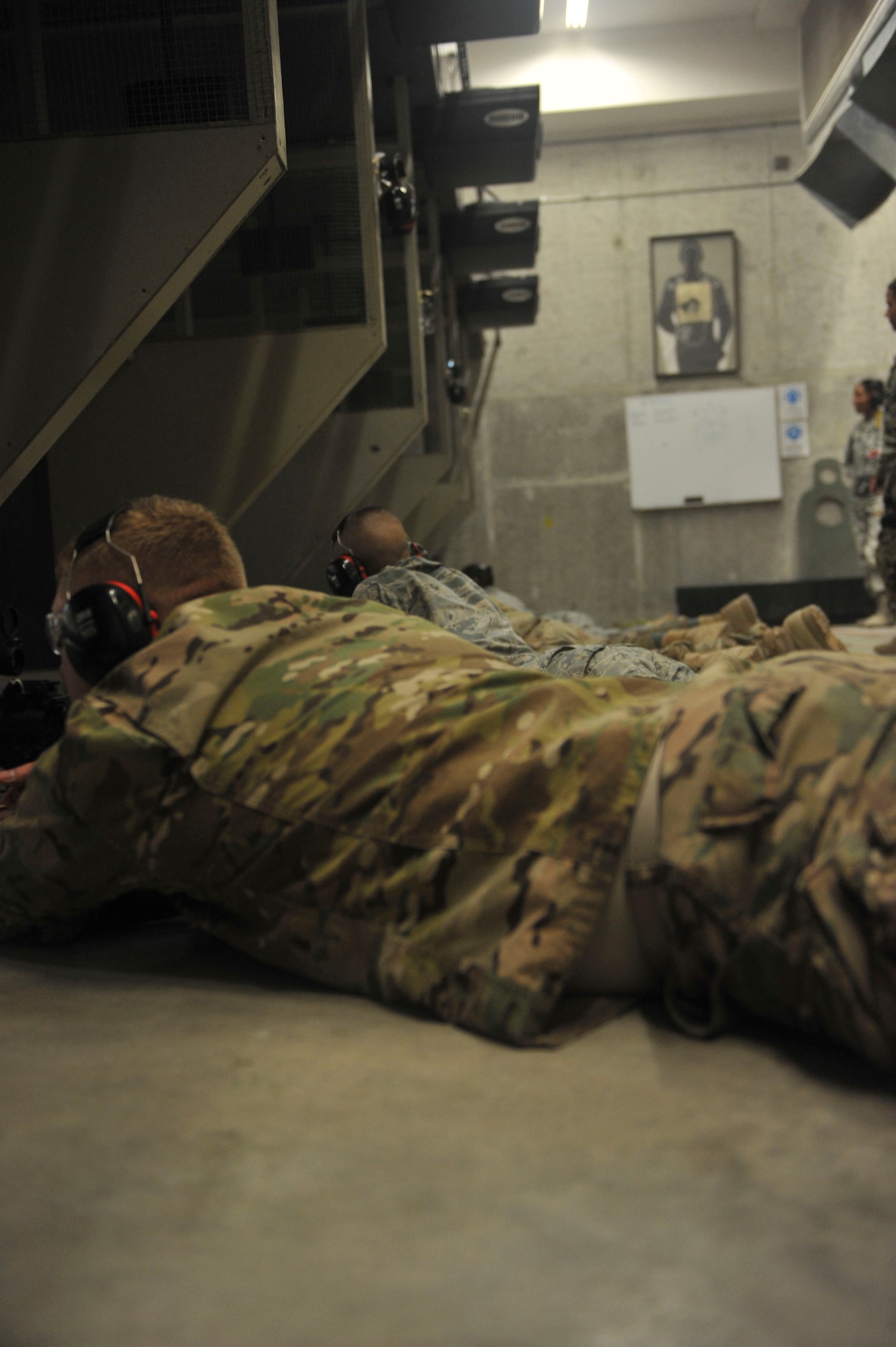 Servicemembers from Special Operations Command Central Forward fire weapons at a firing range at Al Udeid Air Base, Qatar, Oct. 15, 2014. The training that these Airmen receive at SOCCENT firing range ensures everyone is capable and confident with handling their weapon. (U.S. Air Force photo by Senior Airman Colin Cates) 