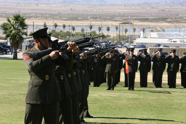 Marines with 1st Battalion, 7th Marine regiment, prepare a 21-gun salute during the memorial ceremony for fallen Marine Sgt. Thomas Spitzer at Lance Corpral Torrey L. Gray Field, Oct. 14, 2014. Spitzer was a mortarman with 1/7 who became a scout sniper in June 2013.