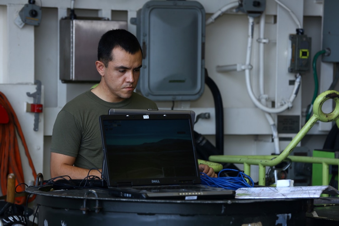 U.S. Marine Corps Sgt. Daniel M. Soto, a joint fires observer with the 1st Air Naval Gunfire Liaison Company detachment, 11th Marine Expeditionary Unit (MEU), and a native of Santa Cruz, California, prepares a computer simulation for a call for fires course aboard the USS San Diego (LPD 22), Oct. 12. Marines from the 11th MEU are deployed with the Makin Island Amphibious Ready Group as a flexible, adaptable and persistent force in the U.S. 5th Fleet area of responsibility. (U.S. Marine Corps photo by Cpl. Jonathan R. Waldman/Released)