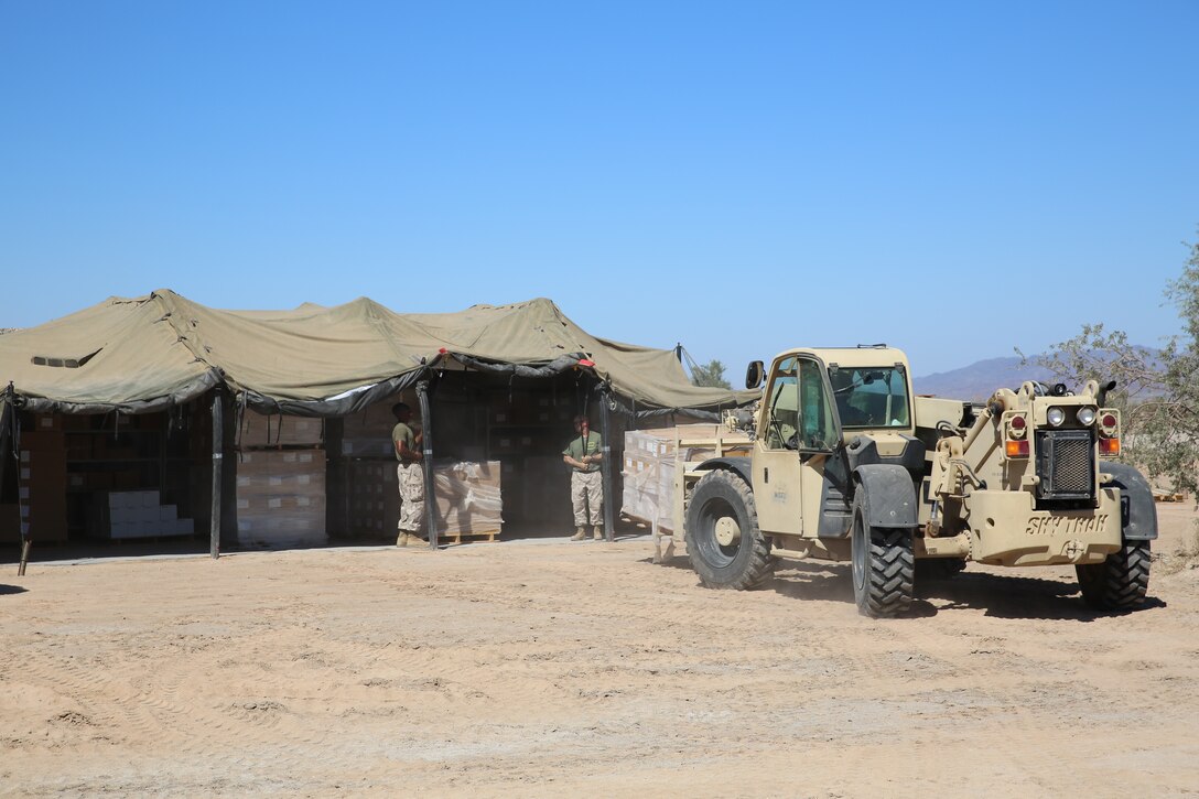 Marines with 1st Supply Battalion, Combat Logistics Regiment 15, 1st Marine Logistics Group, I Marine Expeditionary Force, provide logistical support for the Weapons and Tactics Instructor Course in Yuma, Ariz., Oct. 15, 2014. For more than a month, 1st Supply Bn. provided food, water, and other logistical services to the various forward operating bases where the WTI course Marines were operating.