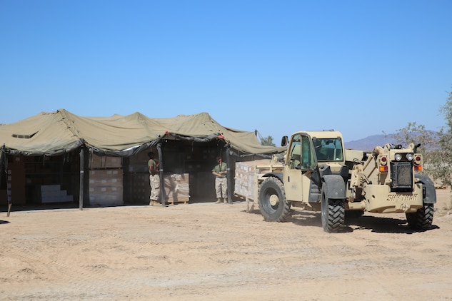 Marines with 1st Supply Battalion, Combat Logistics Regiment 15, 1st Marine Logistics Group, I Marine Expeditionary Force, provide logistical support for the Weapons and Tactics Instructor Course in Yuma, Ariz., Oct. 15, 2014. For more than a month, 1st Supply Bn. provided food, water, and other logistical services to the various forward operating bases where the WTI course Marines were operating.