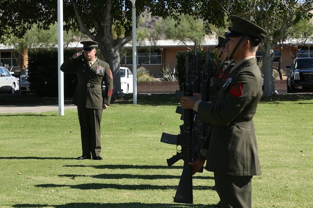 Marines of 1st Battalion, 7th Marine Regiment, present arms during the playing of Taps during the memorial ceremony honoring Sgt. Thomas Spitzer at Lance Corporal Torrey L. Gray Field, Oct. 14, 2014. Taps was played before the family went to pay their respects to their loved one at his memorial.