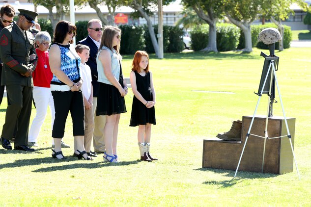 Sgt. Thomas Spitzer’s family and close friends pay their respects during his memorial ceremony held at Lance Corporal Torrey L. Gray Field, Oct. 14, 2014. The memorial for Spitzer was conducted by 1st Battalion, 7th Marine Regiment.