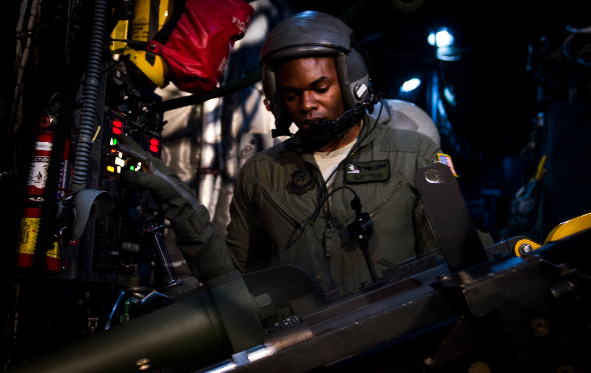 Staff Sgt. Blake Owens, 4th Special Operations Squadron aerial gunner, prepares to reload a 105mm cannon onboard an AC-130U Spooky Gunship during a training flight, Oct. 15, 2014. The AC-130U is the latest in a long line of side-firing gunships which began in the early 1960s with the AC-47D Spooky. (U.S. Air Force photo/Senior Airman Christopher Callaway)