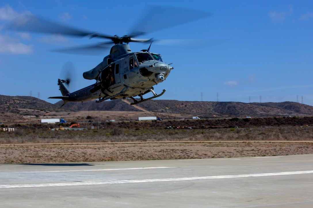 A UH-1Y Huey with Marine Light Attack Helicopter Squadron (HMLA) 369 “Gunfighters,” prepares to land during a familiarization flight aboard Marine Corps Air Station Camp Pendleton, Calif., Oct. 16. Pilots and crews practiced basic flight operations like landings and take offs several times in succession to hone their skills.