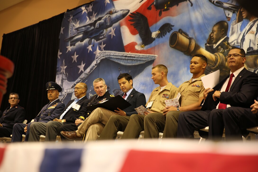 The three honorees sit onstage during the 5th Annual Veterans Expo at the Riverside County Fairgrounds in Indio, Calif., Oct. 11, 2014. Speakers at the ceremony included Congressman Dr. Raul Ruiz and Maj. Gen. Lawrence A. Haskins, commander, 40th Infantry Division, California Army National Guard.