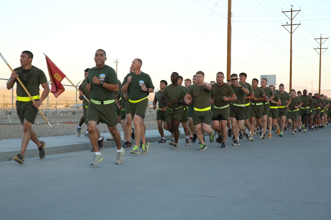 Sgt. Maj. Abel Leal, battalion sergeant major, Headquarters Battalion, leads HQBN on a unit run near the East Gym, Oct. 9, 2014. The formation run was conducted to motivate the Marines and sailors in HQBN.