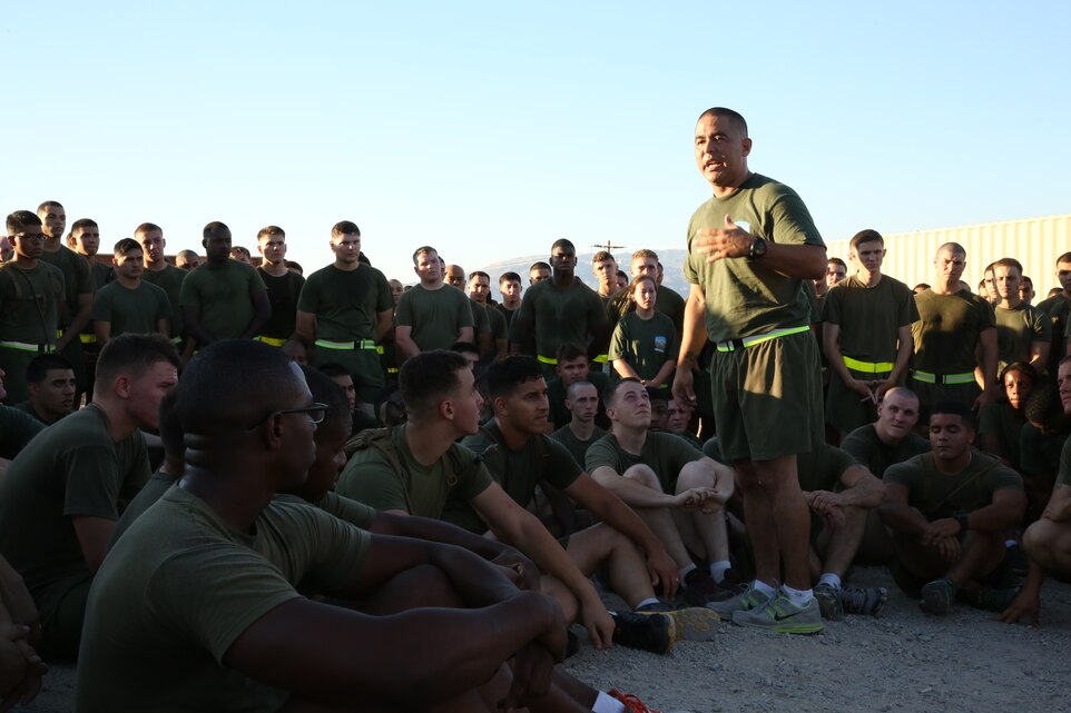 Sgt. Maj. Abel Leal, battalion sergeant major, Headquarters Battalion, talks to headquarters battalion Marines and sailors by the East Gym after a formation run, Oct. 9, 2014.