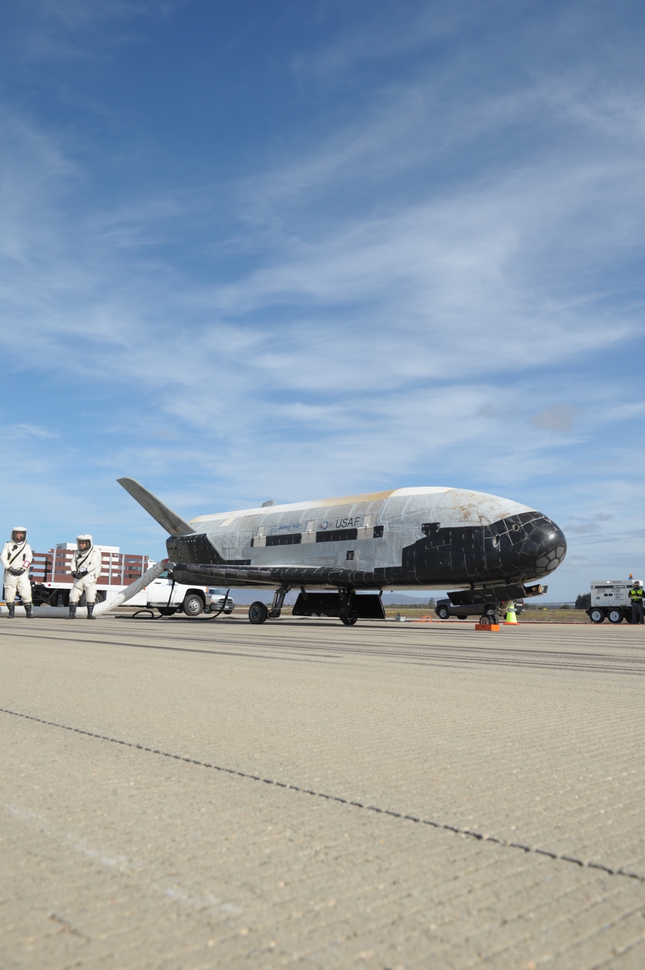 The X-37B Orbital Test Vehicle mission 3 (OTV-3), the Air Force's unmanned, reusable space plane, landed at Vandenberg Air Force Base at 9:24 a.m. Oct. 17, 2014. The OTV-3 conducted on-orbit experiments for 674 days during its mission, extending the total number of days spent on-orbit for the OTV program to 1367 days. The X-37B is the newest and most advanced re-entry spacecraft. Managed by the Air Force Rapid Capabilities Office, the X-37B program performs risk reduction, experimentation and concept of operations development for reusable space vehicle technologies. (Photo credit: Boeing)