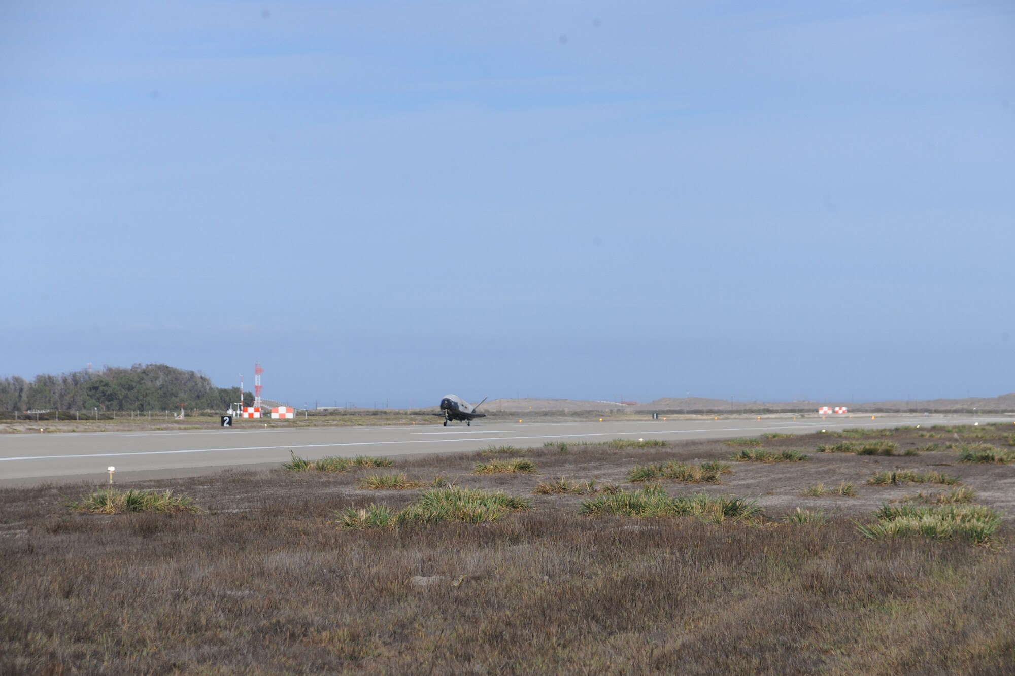 The X-37B Orbital Test Vehicle mission 3 (OTV-3), the Air Force's unmanned, reusable space plane, landed at Vandenberg Air Force Base at 9:24 a.m. Oct. 17, 2014. The OTV-3 conducted on-orbit experiments for 674 days during its mission, extending the total number of days spent on-orbit for the OTV program to 1367 days. The X-37B is the newest and most advanced re-entry spacecraft. Managed by the Air Force Rapid Capabilities Office, the X-37B program performs risk reduction, experimentation and concept of operations development for reusable space vehicle technologies. (Photo credit: Boeing)