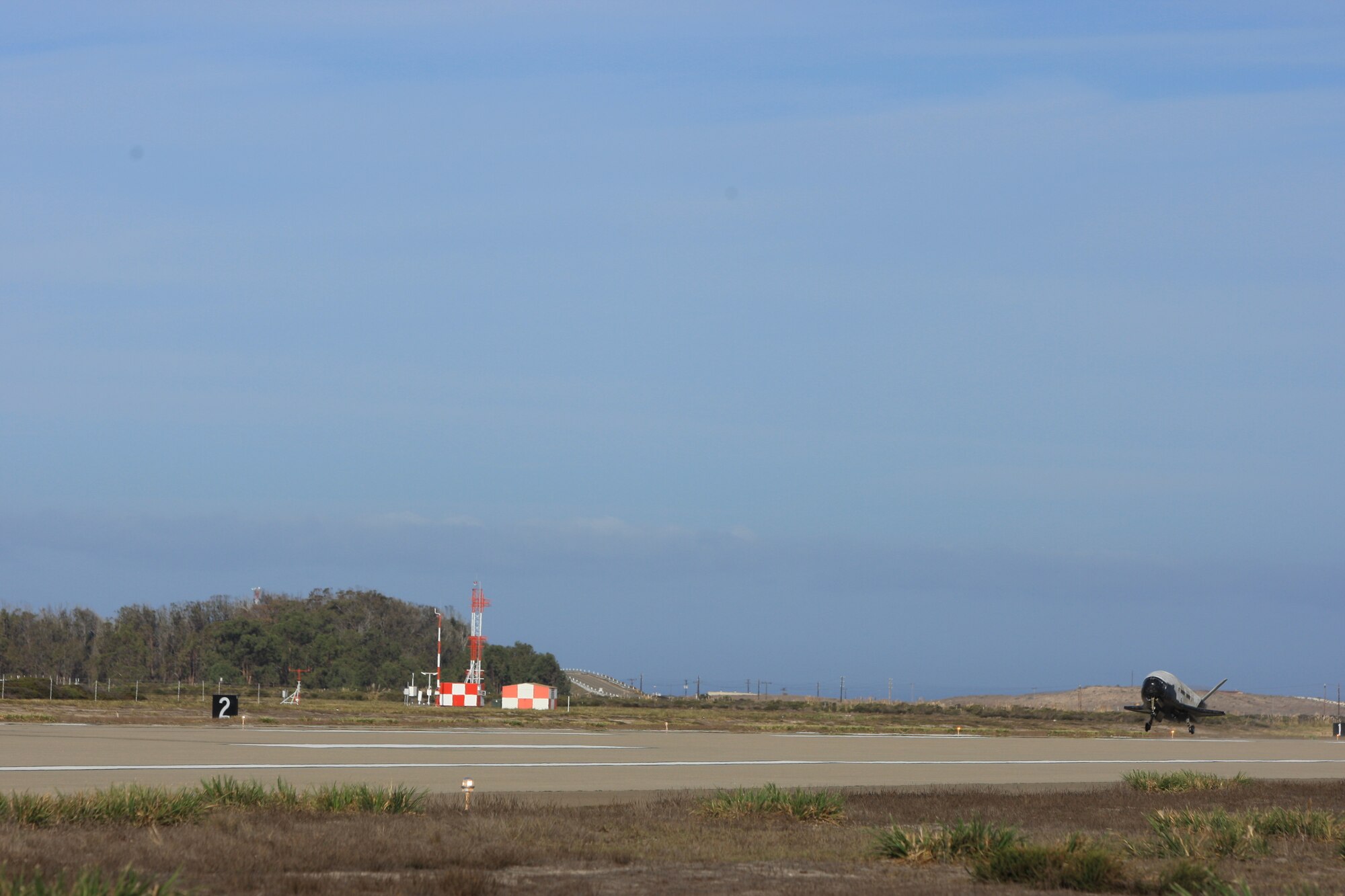 The X-37B Orbital Test Vehicle mission 3 (OTV-3), the Air Force's unmanned, reusable space plane, landed at Vandenberg Air Force Base at 9:24 a.m. Oct. 17, 2014. The OTV-3 conducted on-orbit experiments for 674 days during its mission, extending the total number of days spent on-orbit for the OTV program to 1367 days. The X-37B is the newest and most advanced re-entry spacecraft. Managed by the Air Force Rapid Capabilities Office, the X-37B program performs risk reduction, experimentation and concept of operations development for reusable space vehicle technologies. (Photo credit: Boeing)