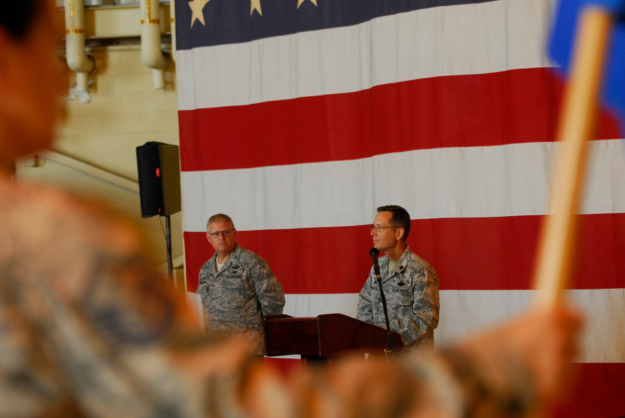 U.S. Air Force Lt. Col. Stephen Mallette (center), 145th Maintenance Group commander, speaks to his new unit about his dedication to the unit and its future after assuming command at a ceremony held at the North Carolina Air National Guard Base, Charlotte Douglas Intl. Airport, Oct. 4, 2014. (U.S. Air National Guard photo by Staff Sgt. Julianne M. Showalter, 145th Public Affairs/Released)