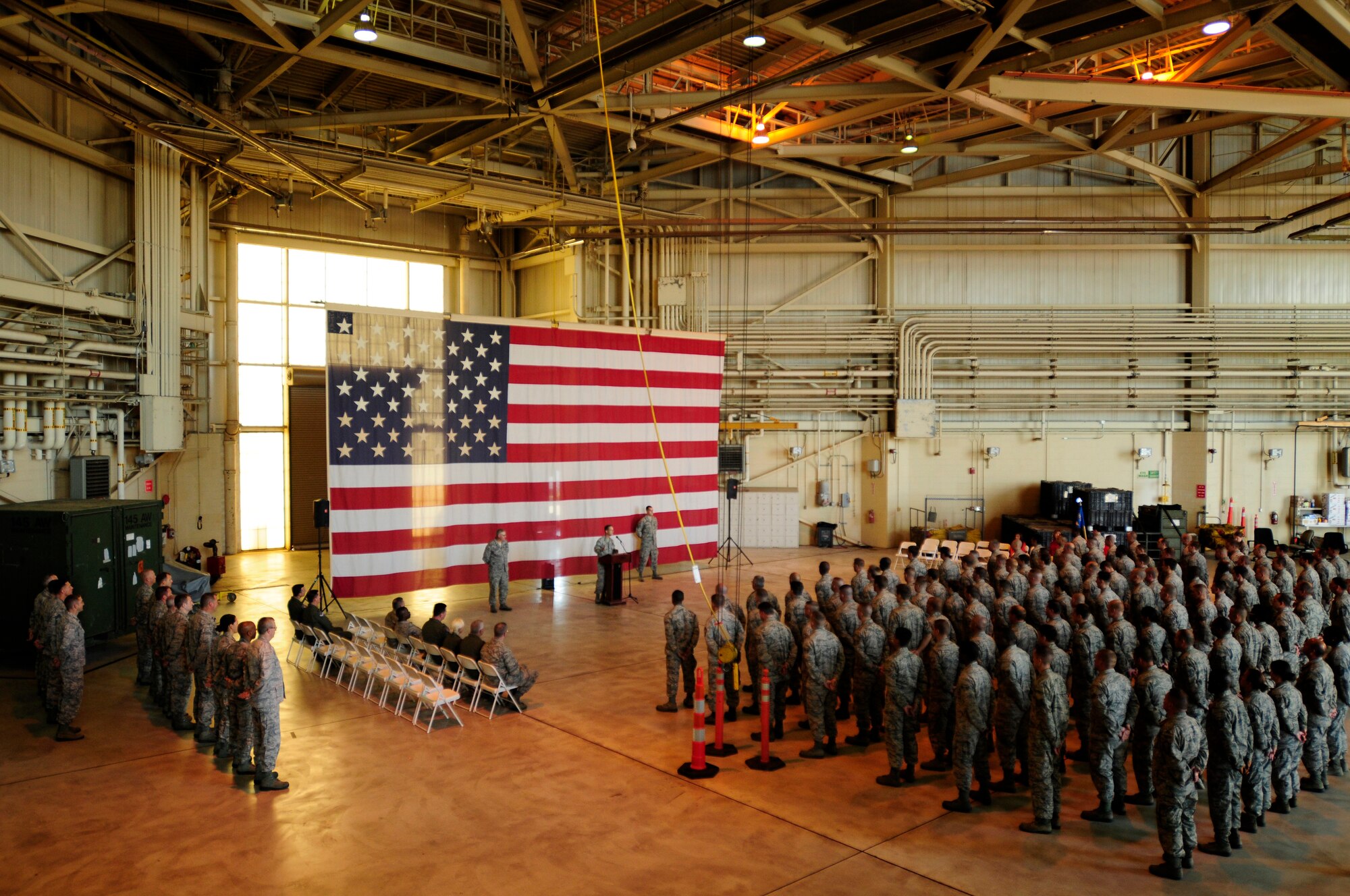 Members of the 145th Maintenance Group stand in formation during an assumption of command ceremony for U.S. Air Force Lt. Col. Stephen Mallette as he takes command of the 145th MXG during a ceremony held at the North Carolina Air National Guard Base, Charlotte Douglas Intl. Airport, Oct. 4, 2014. During the ceremony, the unit flag is handed off symbolically indicating to all, his authority as the commanding officer. (U.S. Air National Guard photo by Staff Sgt. Julianne M. Showalter, 145th Public Affairs/Released)