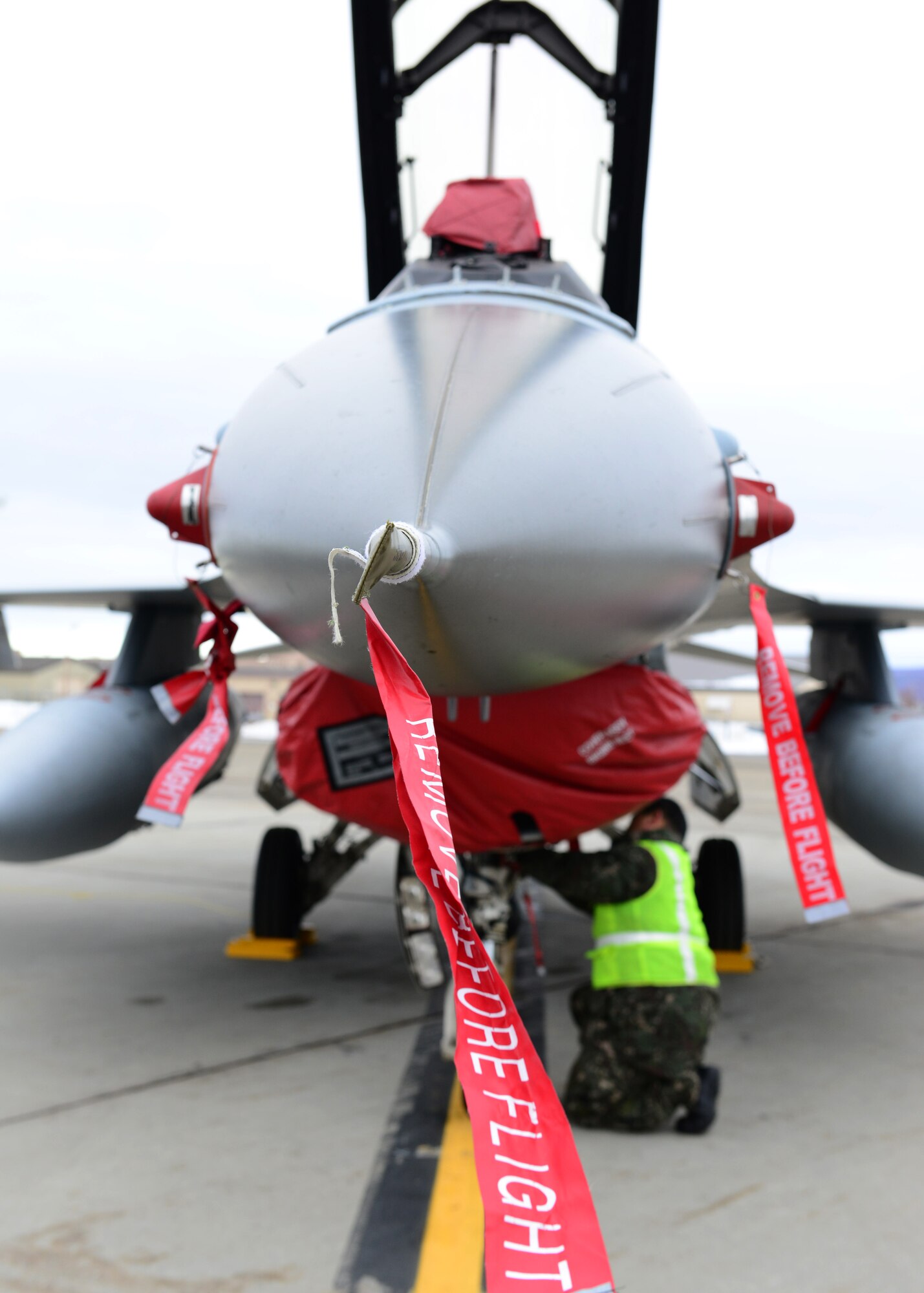 Republic of Korea air force Master Sgt. Soo Young Chae, a crew chief assigned to the 120th Aircraft Maintenance Flight, prepares a KF-16D Fighting Falcon fighter aircraft for a sortie at Eielson Air Force Base, Alaska, Oct. 15, 2014, during RED FLAG-Alaska 15-1. RF-A is a series of Pacific Air Forces commander-directed field training exercises for U.S. and partner nation forces, providing combined offensive counter-air, interdiction, close air support and large force employment training in a simulated combat environment. (U.S. Air Force photo by Senior Airman Ashley Nicole Taylor/Released)