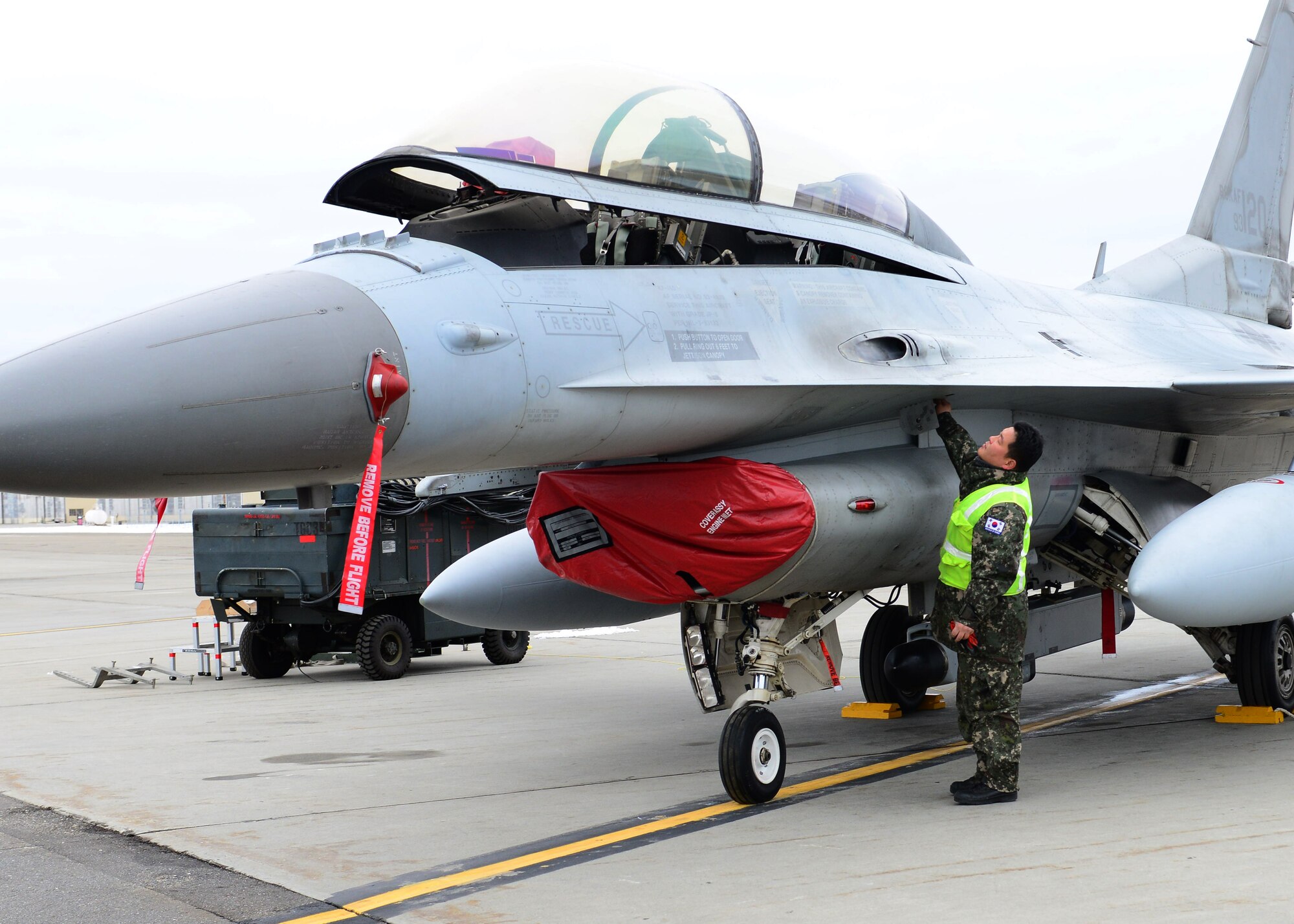Republic of Korea air force Master Sgt. Soo Young Chae, a crew chief assigned to the 120th Aircraft Maintenance Flight, opens the canopy of an KF-16D Fighting Falcon fighter aircraft Oct. 15, 2014, at Eielson Air Force Base, Alaska, during RED FLAG-Alaska 15-1. RF-A is a series of Pacific Air Forces commander-directed field training exercises for U.S. and partner nation forces, providing combined offensive counter-air, interdiction, close air support and large force employment training in a simulated combat environment. (U.S. Air Force photo by Senior Airman Ashley Nicole Taylor/Released)