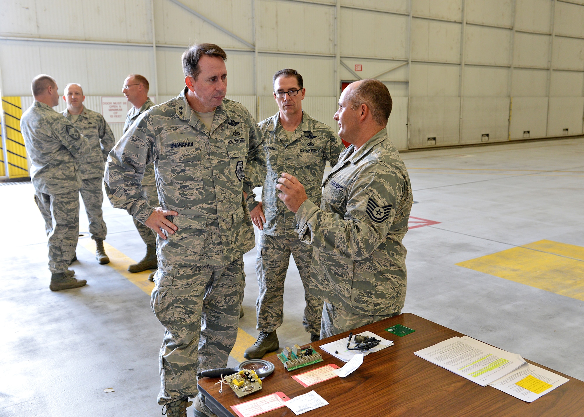 (Right) Tech. Sgt. Kevin Marshall talks to Maj. Gen. John Shanahan (left), 25th Air Force commander, and Chief Master Sgt. Roger Towberman, 25th AF command chief, about the contributions the 9th Reconnaissance Wing has made to the Air Force Repair Enhancement Program at Beale Air Force Base, Calif., Oct. 15, 2014. Shanahan and Towberman visited Beale for the first time since the Sept. 29 re-alignment of the 9th RW to the 25th AF. (U.S Air Force photo by John Schwab/Released)