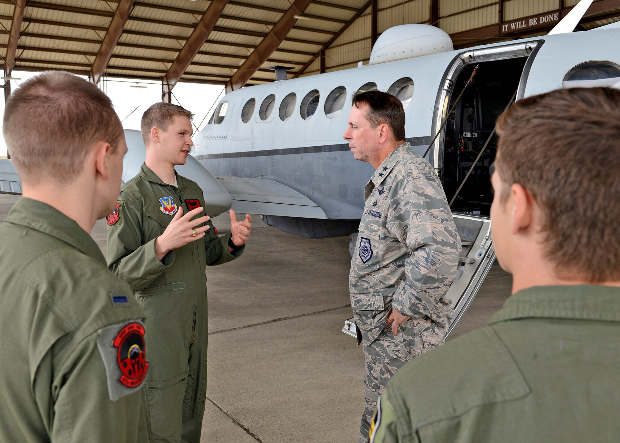 MC-12 Liberty aircrew members speak with Maj. Gen. John Shanahan, 25th Air Force commander, during his visit to the 9th Reconnaissance Wing at Beale Air Force Base, Calif., Oct. 15, 2014. Shanahan and Chief Master Sgt. Roger Towberman, 25th AF command chief, visited Beale for the first time since the Sept. 29 re-alignment of the 9th RW to the 25th AF.  (U.S Air Force photo by John Schwab/Released)