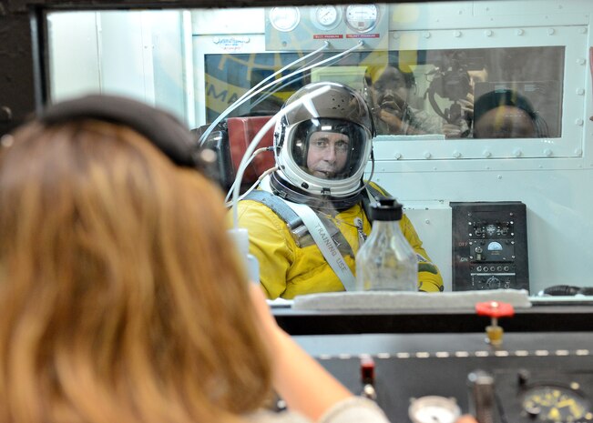 Maj. Gen. John Shanahan, 25th Air Force commander, sits in an altitude chamber in a pressure suit during his visit to the 9th Reconnaissance Wing at Beale Air Force Base, Calif., Oct. 15, 2014. The chamber tests the functionality of the pressure suit when altitude is artificially increased. (U.S Air Force photo by John Schwab/Released)