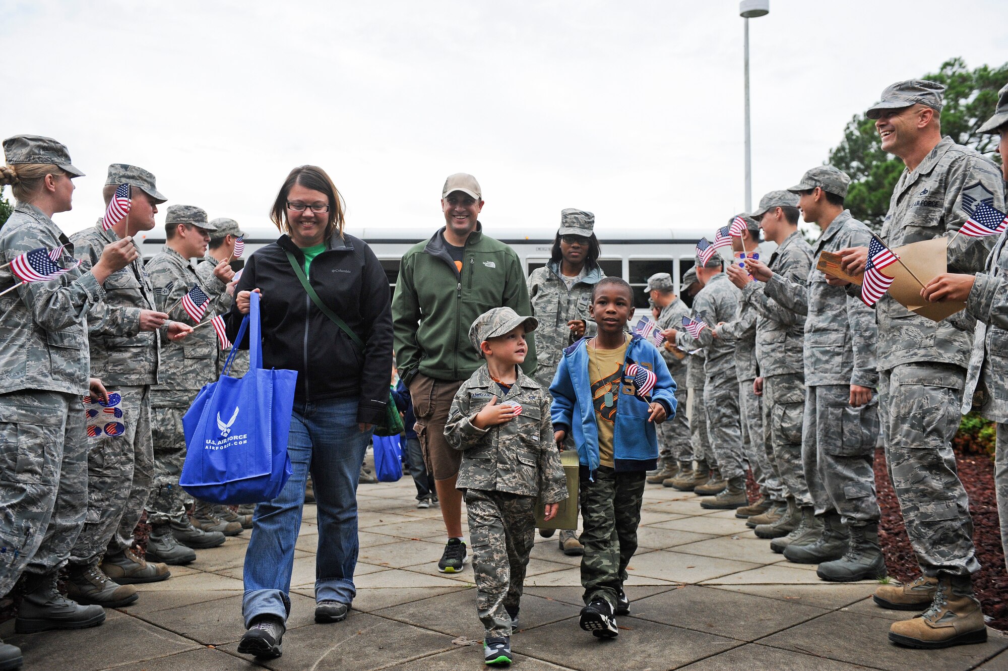 Some of Team Seymour’s youngest members return from their deployment during the Airman and Family Readiness Center’s Operation Bug Out at Seymour Johnson Air Force Base, North Carolina, Oct. 15. In order to help the children of Seymour Johnson AFB understand what their parents do to prepare for real-world deployments, children between the ages of five and 15 participated in a mock deployment. The event mirrored the events of an actual deployment including briefings, processing through a personnel deployment function line and transporting their equipment to an awaiting military aircraft. (U.S. Air Force photo/Airman 1st Class Aaron Jenne)