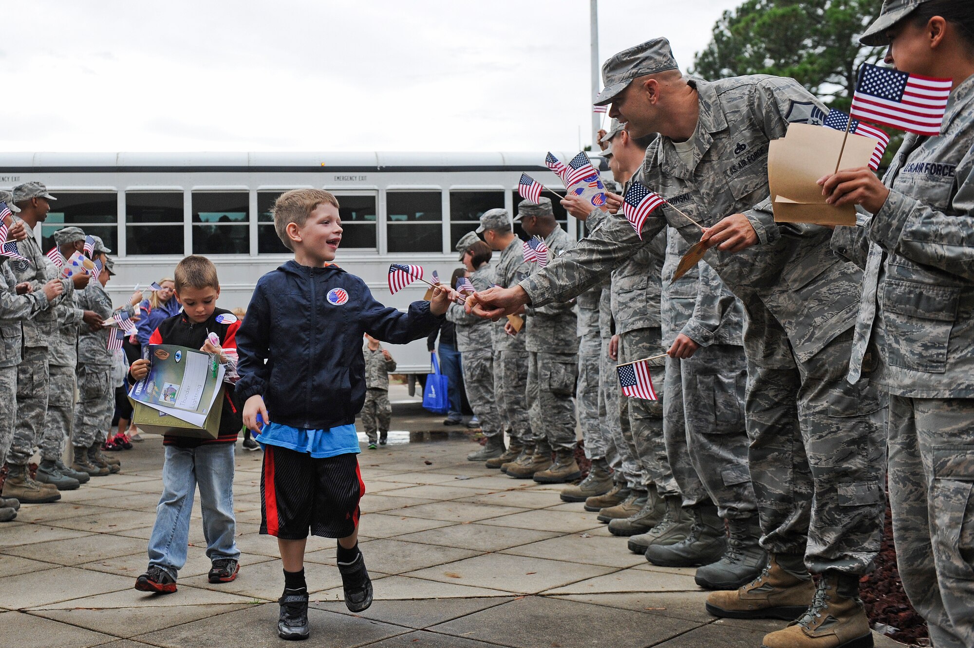 Some of Team Seymour’s youngest members return from their deployment during the Airman and Family Readiness Center’s Operation Bug Out at Seymour Johnson Air Force Base, North Carolina, Oct. 15. In order to help the children of Seymour Johnson AFB understand what their parents do to prepare for real-world deployments, children between the ages of five and 15 participated in a mock deployment. The event mirrored the events of an actual deployment including briefings, processing through a personnel deployment function line and transporting their equipment to an awaiting military aircraft. (U.S. Air Force photo/Airman 1st Class Aaron Jenne)