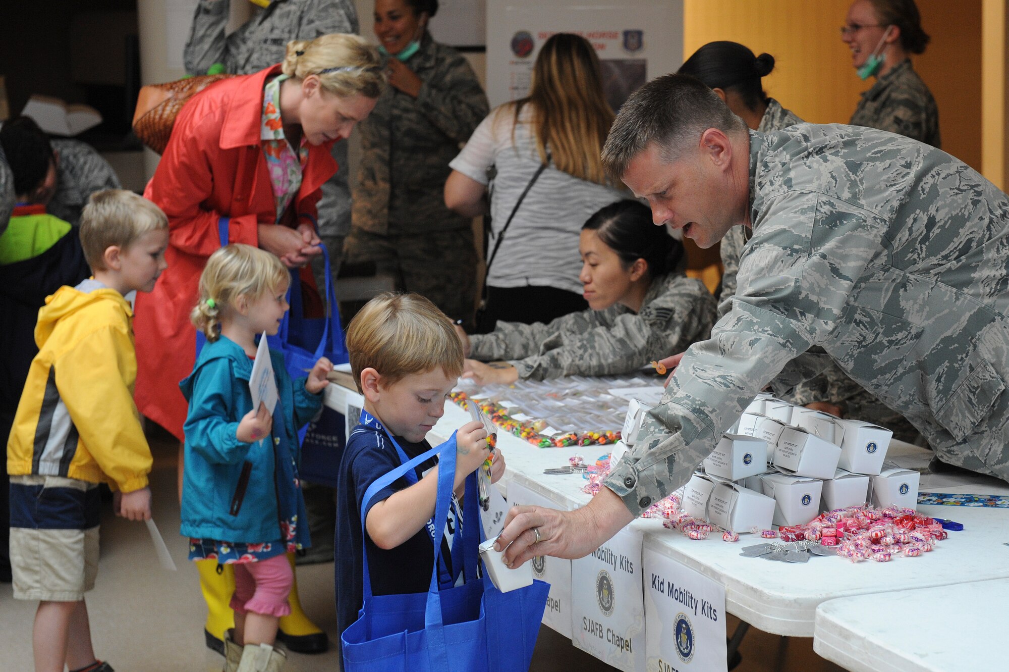 Some of Team Seymour’s youngest members get ready to support the Airman and Family Readiness Center’s Operation Bug Out at Seymour Johnson Air Force Base, North Carolina, Oct. 15. In order to help the children of Seymour Johnson AFB understand what their parents do to prepare for real-world deployments, children between the ages of five and 15 participated in a mock deployment. The event mirrored the events of an actual deployment including briefings, processing through a personnel deployment function line and transporting their equipment to an awaiting military aircraft. (U.S. Air Force photo/Airman 1st Class Aaron Jenne)