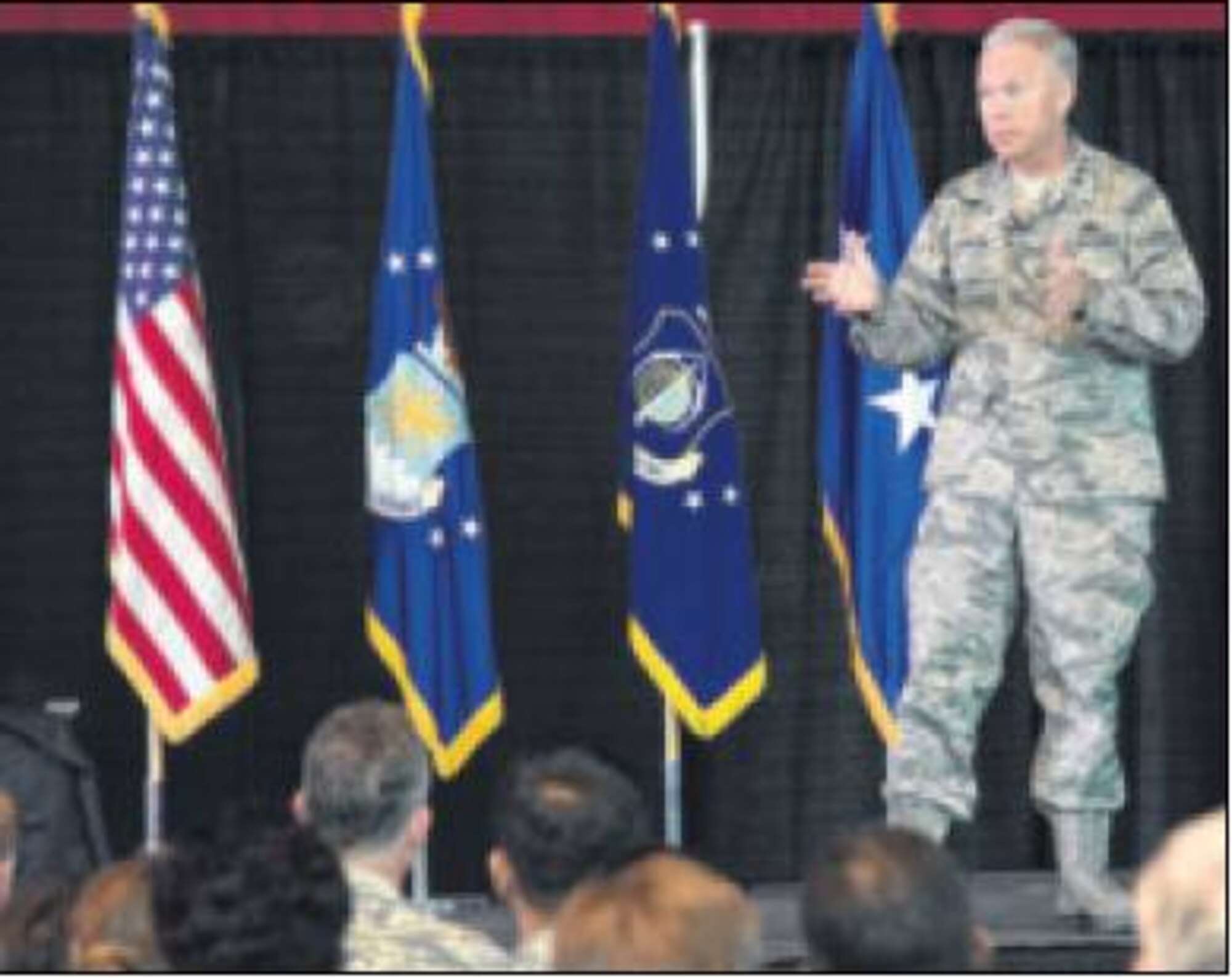 Lt. Gen. John Thompson, Air Force Life Cycle Management Center commander, addresses members of the Hanscom community inside the Aero Club hangar during an All-Call Oct. 9. This was Thompson's first visit to hanscom after assuming the role of center commander. During the event, he assured the team the mission and vision would remain the same, and encouraged members to stay resilient. (Air Force photo by mark Herlihy)