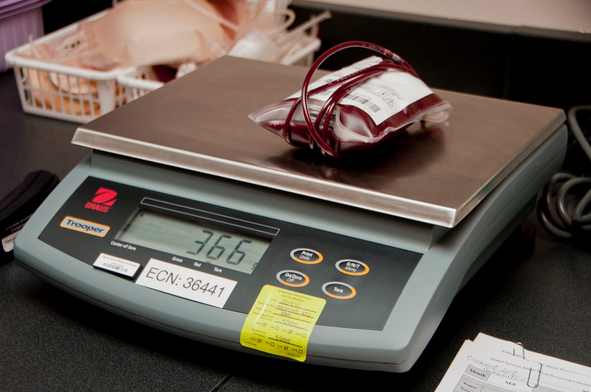 Recording the weight of each individual blood bag serves as a key tenet when processing and shipping blood units.  (U.S. Air Force photo by Senior Airman Charles Rivezzo)