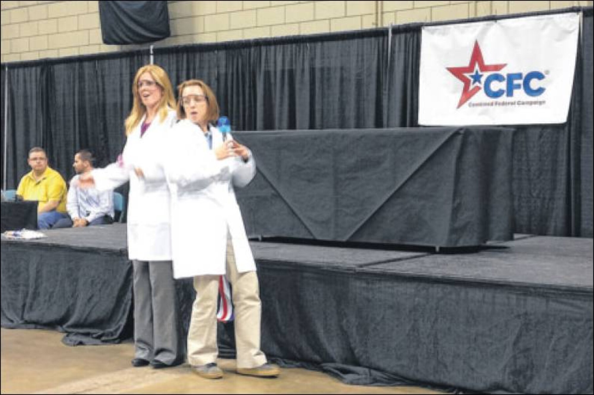 A new event at the 2014 Miami Valley Combined federal Campaign's Charity fair and Kickoff Oct. 8 at the Nutter Center was the Lip Sync Battle. The winning act was the medical records worker Aprol Milton and chemist Sally Eagan, both of the U.S. Air Force School of Aerospace medicine, who performed "The Scientist." (Skywrighter photo by Amy Rollins)