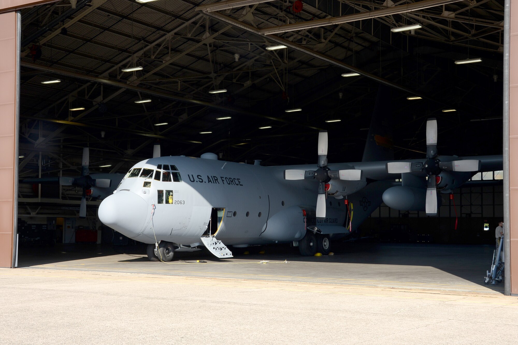 One year after the arrival of the first C-130H Hercules aircraft at Bradley Air National Guard Base, East Granby, Conn., the eighth and final aircraft awaits tail paint in the hangar Friday, October 17, 2014.  The Flying Yankees' acceptance of the final aircraft assigned to the 103rd Airlift Wing, Wednesday, October 15, 20104, marks an important milestone in the unit's conversion to the C-130H mission.  (U.S. Air National Guard photo by Master Sgt. Erin McNamara/RELEASED)