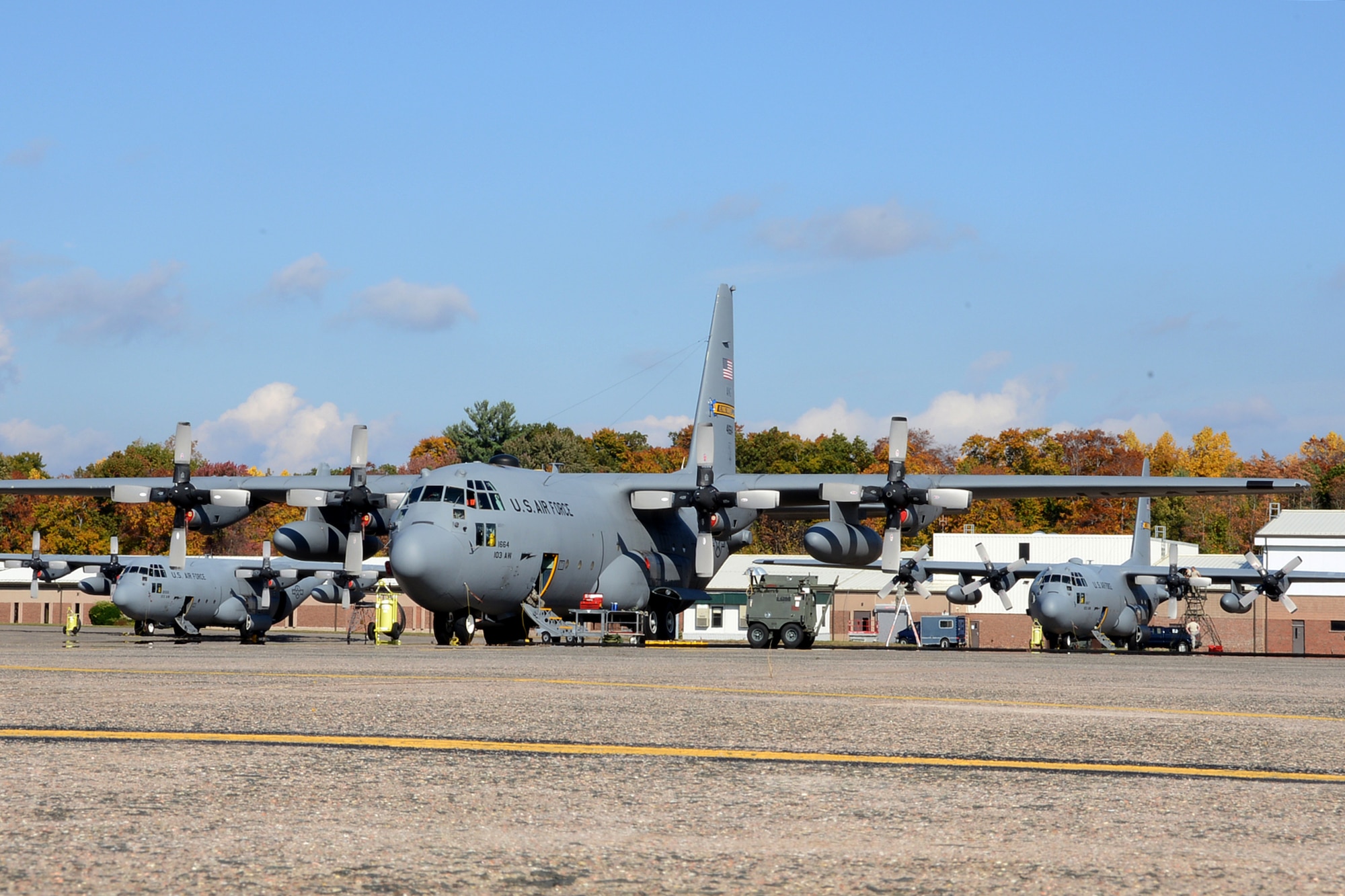 One year after the arrival of the first C-130H Hercules aircraft at Bradley Air National Guard Base, East Granby, Conn., a full fleet of aircraft adds color to the fall flightline, Friday, October 17, 2014.  The Flying Yankees' acceptance of the final of eight aircraft assigned to the 103rd Airlift Wing, Wednesday, October 15, 2014, marks an important milestone in the unit's conversion to the C-130 mission.  (U.S. Air National Guard photo by Master Sgt Erin McNamara)