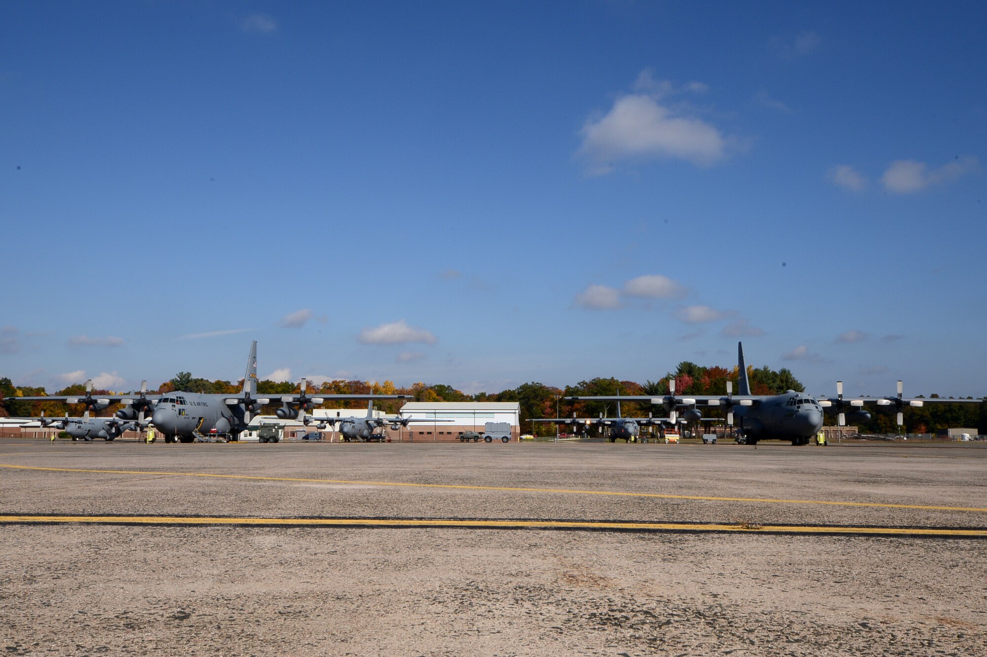 One year after the arrival of the first C-130H Hercules aircraft at Bradley Air National Guard Base, East Granby, Conn., a full fleet of aircraft adds color to the fall flightline, Friday, October 17, 2014.  The Flying Yankees' acceptance of the final of eight aircraft assigned to the 103rd Airlift Wing, Wednesday, October 15, 2014, marks an important milestone in the unit's conversion to the C-130 mission.  (U.S. Air National Guard photo by Master Sgt Erin McNamara)