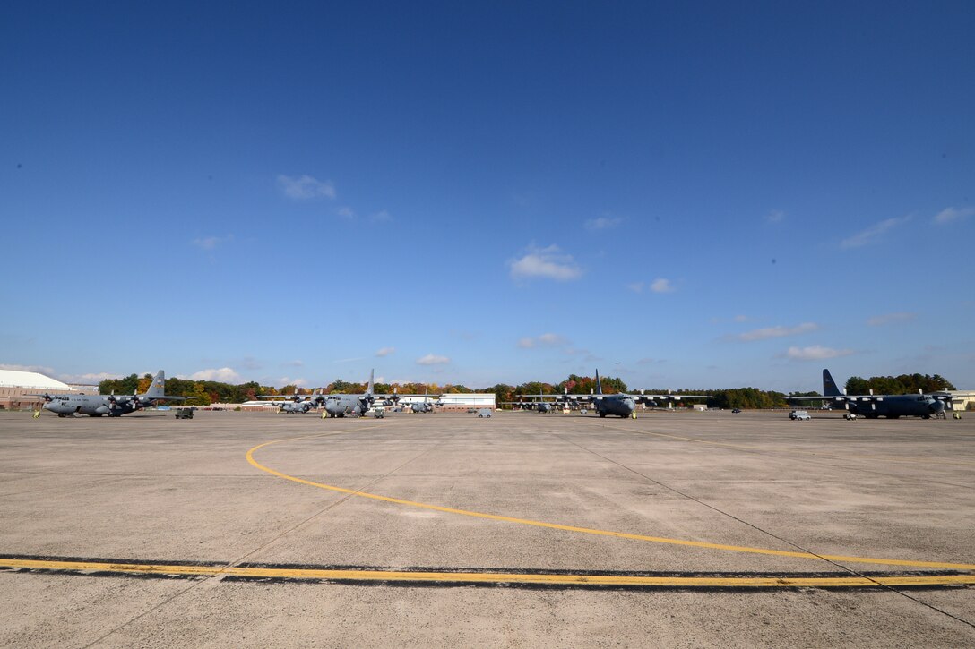 One year after the arrival of the first C-130H Hercules aircraft at Bradley Air National Guard Base, East Granby, Conn., a full fleet of aircraft adds color to the fall flightline, Friday, October 17, 2014.  The Flying Yankees' acceptance of the final of eight aircraft assigned to the 103rd Airlift Wing, Wednesday, October 15, 2014, marks an important milestone in the unit's conversion to the C-130 mission.  (U.S. Air National Guard photo by Master Sgt Erin McNamara)