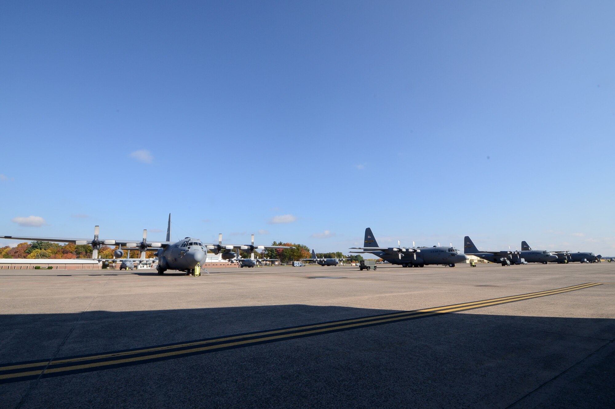 One year after the arrival of the first C-130H Hercules aircraft at Bradley Air National Guard Base, East Granby, Conn., a full fleet of aircraft adds color to the fall flightline, Friday, October 17, 2014.  The Flying Yankees' acceptance of the final of eight aircraft assigned to the 103rd Airlift Wing, Wednesday, October 15, 2014, marks an important milestone in the unit's conversion to the C-130 mission.  (U.S. Air National Guard photo by Master Sgt Erin McNamara)