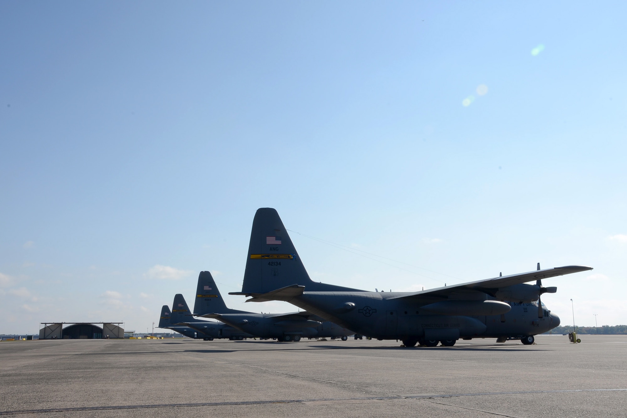 One year after the arrival of the first C-130H Hercules aircraft at Bradley Air National Guard Base, East Granby, Conn., a full fleet of aircraft occupies the flightline Friday, October 17, 2014.  The Flying Yankees' acceptance of the final of eight aircraft assigned to the 103rd Airlift Wing, Wednesday, October 15, 2014, marks an important milestone in the unit's conversion to the C-130H mission.  (U.S. Air National Guard photo by Master Sgt Erin McNamara)