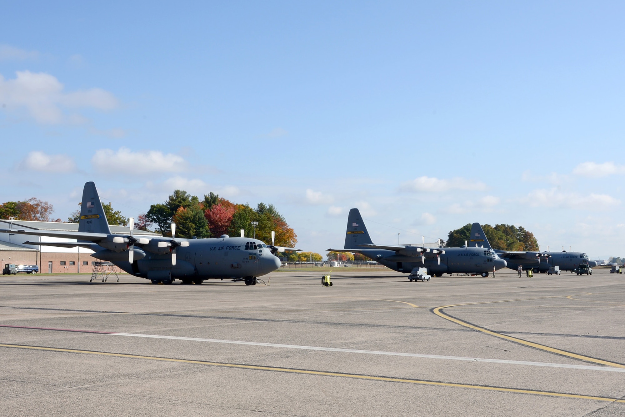 One year after the arrival of the first C-130H Hercules at Bradley Air National Guard Base in East Granby, Conn., a full fleet of aircraft adds color to the fall flight line Friday, October 17, 2014.  The Flying Yankees' acceptance of the final of eight aircraft assigned to the 103rd Airlift Wing Wednesday, October 15, 20104, marks an important milestone in the unit's conversion to the C-130 mission.  (U.S. Air National Guard photo by Master Sgt Erin McNamara)