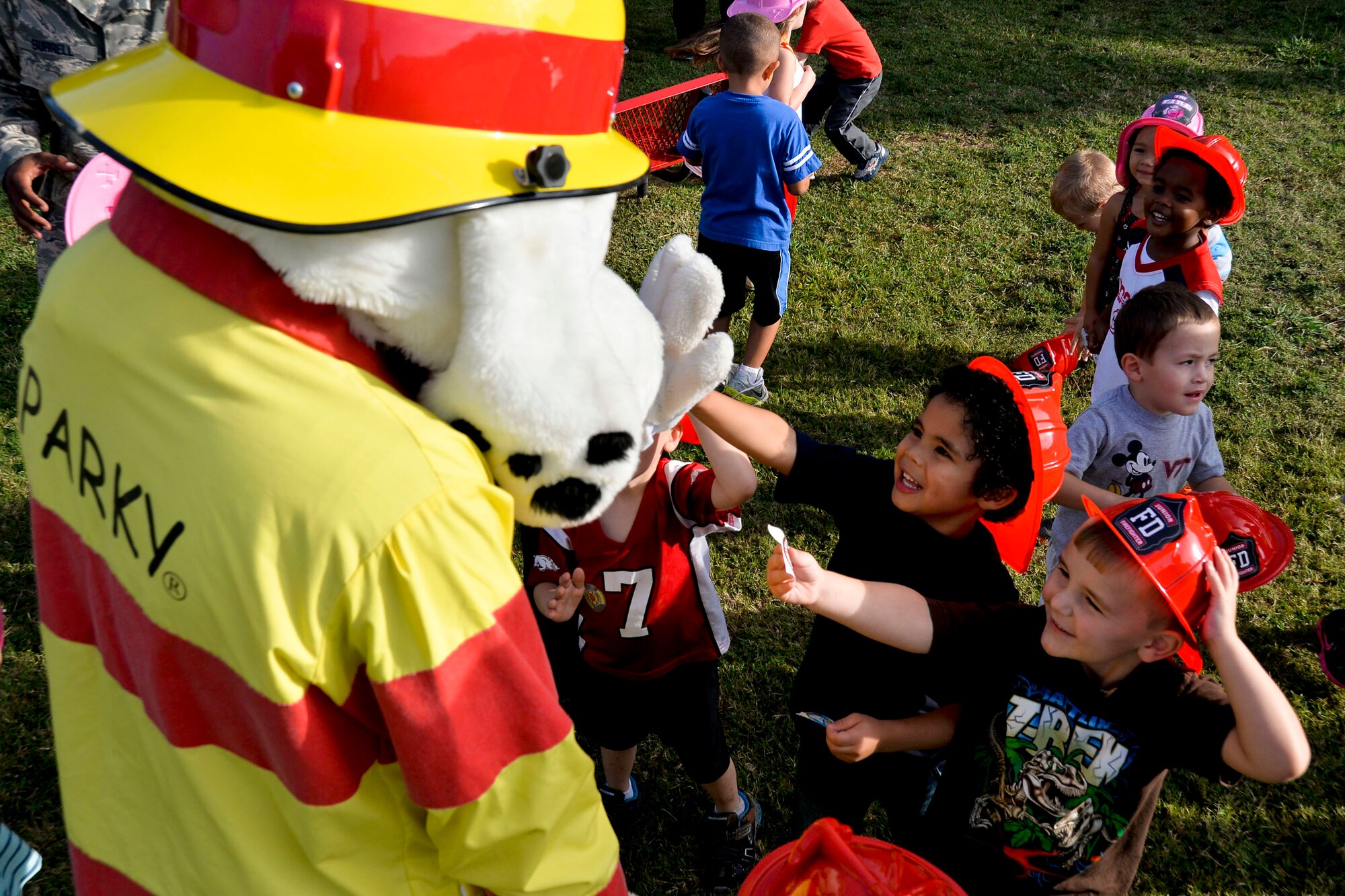 Sparky the Fire Dog visits children during National Fire Prevention Week at the Child Development Center on Barksdale Air Force Base, La., Oct. 8, 2014. Fire prevention week aims to increase awareness and educate people on the importance of smoke alarms and their maintenance. (U.S. Air Force photo/Airman 1st Class Mozer O. Da Cunha)