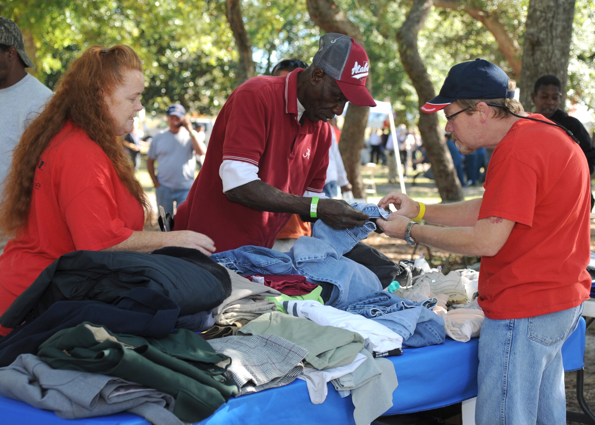 Sherry and Chris Burroughs, Veterans of Foreign Wars Post 3373 in Pascagoula, Miss., assist Army veteran Ezekal Robinson with clothing sizes during the 2014 Homeless Veteran Stand Down Oct. 16, 2014, at Hiller Park, Biloxi, Miss.  The Stand Down, sponsored by VA, local veteran organizations and other community organizations, provided medical services and information to homeless Veterans and families of homeless Veterans. The veterans received medical screenings, flu shots, VA social work services, a hot meal, haircuts, clothing, boots and blankets. Robinson served from 1978-1982.  (U.S. Air Force photo Kemberly Groue)