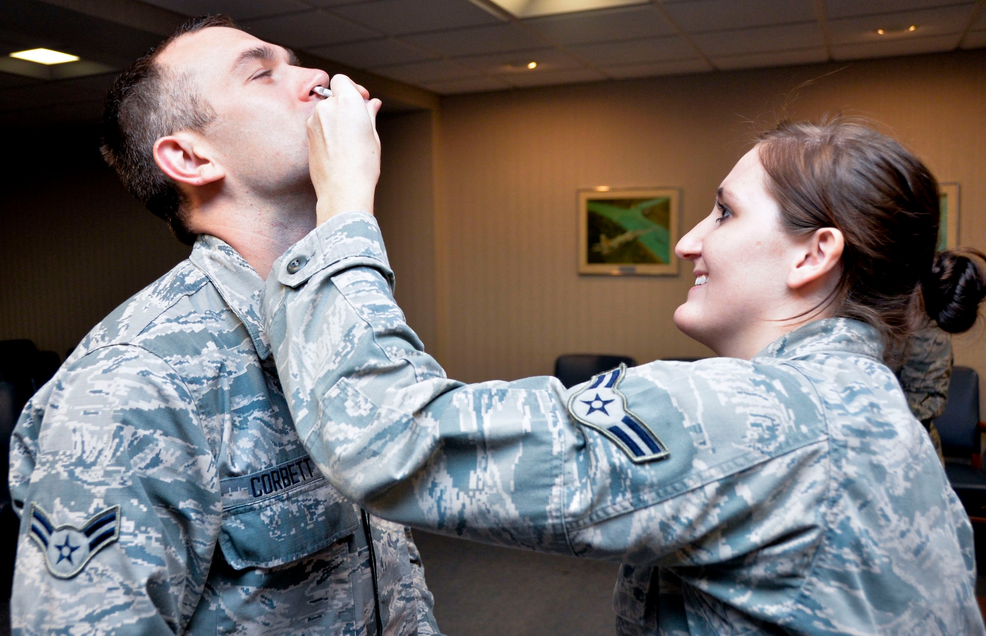 Airman 1st Class Christopher Corbett, 2nd Bomb Wing command post operator, receives the flu mist vaccination on Barksdale Air Force Base, La., Oct. 9, 2014. The nasal mist vaccination is recommended for healthy individuals ages 2 through 49. (U.S. Air Force photo/Airman 1st Class Mozer O. Da Cunha)
