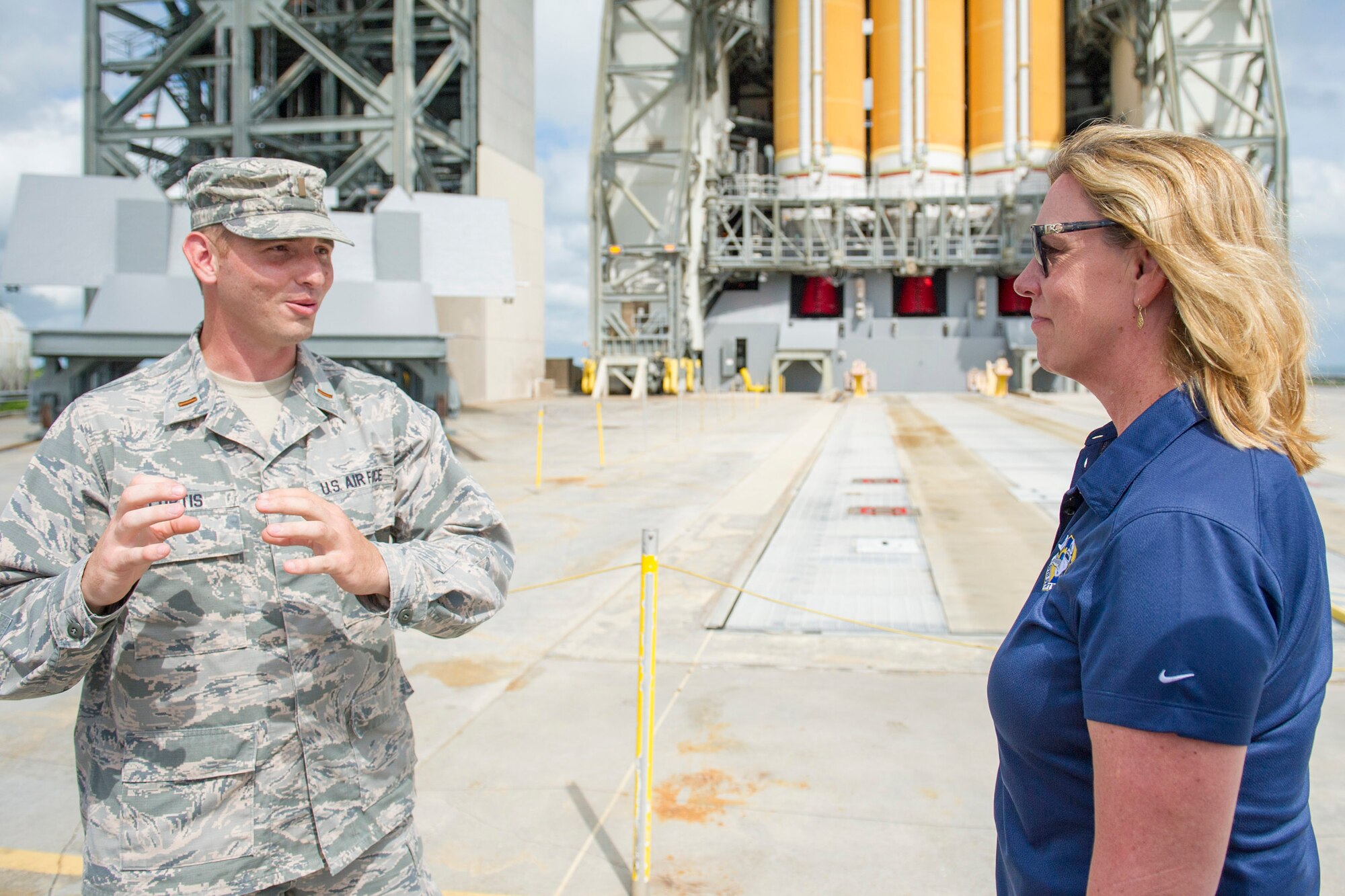 Second Lt. Heath Curtis, 5th Space Launch Squadron, gives Secretary of the Air Force Deborah Lee James a Delta rocket booster processing briefing, during a tour of Cape Canaveral Air Force Station, Fla., Oct. 15, 2014.  The daylong visit included tours of Air Force Eastern Range launch assets as well as a windshield tour of NASA’s Kennedy Space Center.  (U.S. Air Force photo/Matthew Jurgens)