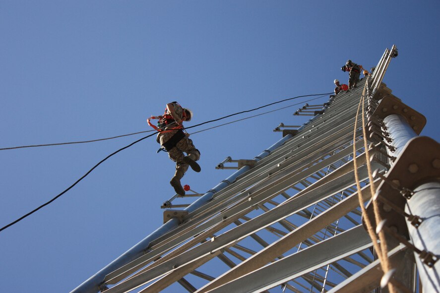 Airmen from the 2nd Communications Squadron work on an antenna tower on Barksdale Air Force Base, La., May 6, 2011. Airmen climb antennas used for air-to-ground operations in order to perform preventive maintenance inspections. (Courtesy photo)
