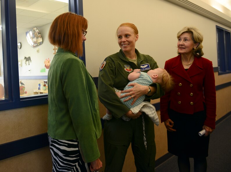 Kim Starr, left, U.S. Air Force Capt. Kristen Jenkins and son, Nathan, and Kay Bailey Hutchison, former U.S. senator, talk at the Child Development Center Oct. 15, 2014, at Dyess Air Force Base, Texas. During Hutchison’s tenure in the U.S. Senate, she supported not only the CDC but other key programs at Dyess. (U.S. Air Force photo by Airman 1st Class Kedesha Pennant/Released)