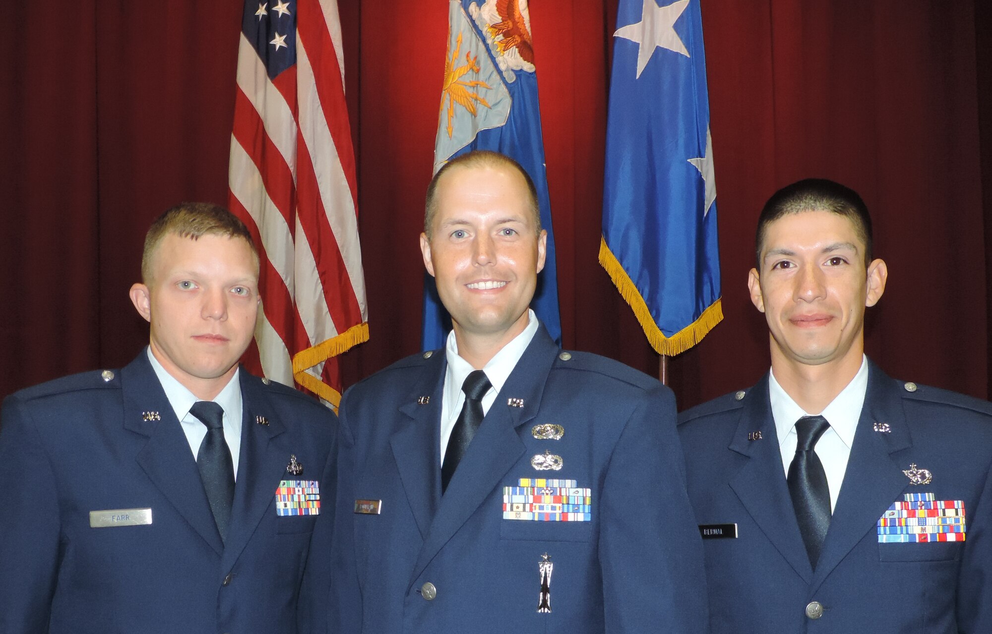 Texas Air National Guard Officer Candidates Jeremy D. Farr, 272nd Engineering and Installation Squadron, Phillip B. Fountain, 149th Fighter Wing, and Bernal Adam, 149th Civil Engineering pose moments before being commissioned officers. They graduated from the Air National Guard’s Academy of Military Science at Maxwell Air Force Base, Ala., (Air National Guard photo by Col. Nahaku A. McFadden)