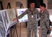 Airman 1st Class Nicholas Nalley, 4th Medical Support Squadron medical logistics technician, briefs Brig Gen. (Dr.) Sean Murphy, the command surgeon at Air Combat Command, on future upgrades to the 4th Medical Group facility during an orientation tour of the 4th Medical Group on Oct. 17, 2014, at Seymour Johnson North Carolina. Murphy took time to interact with the Airmen assigned to the 4th MDG and received several briefings during his visit. (U.S. Air Force photo/Airman 1st Class Brittain Crolley)