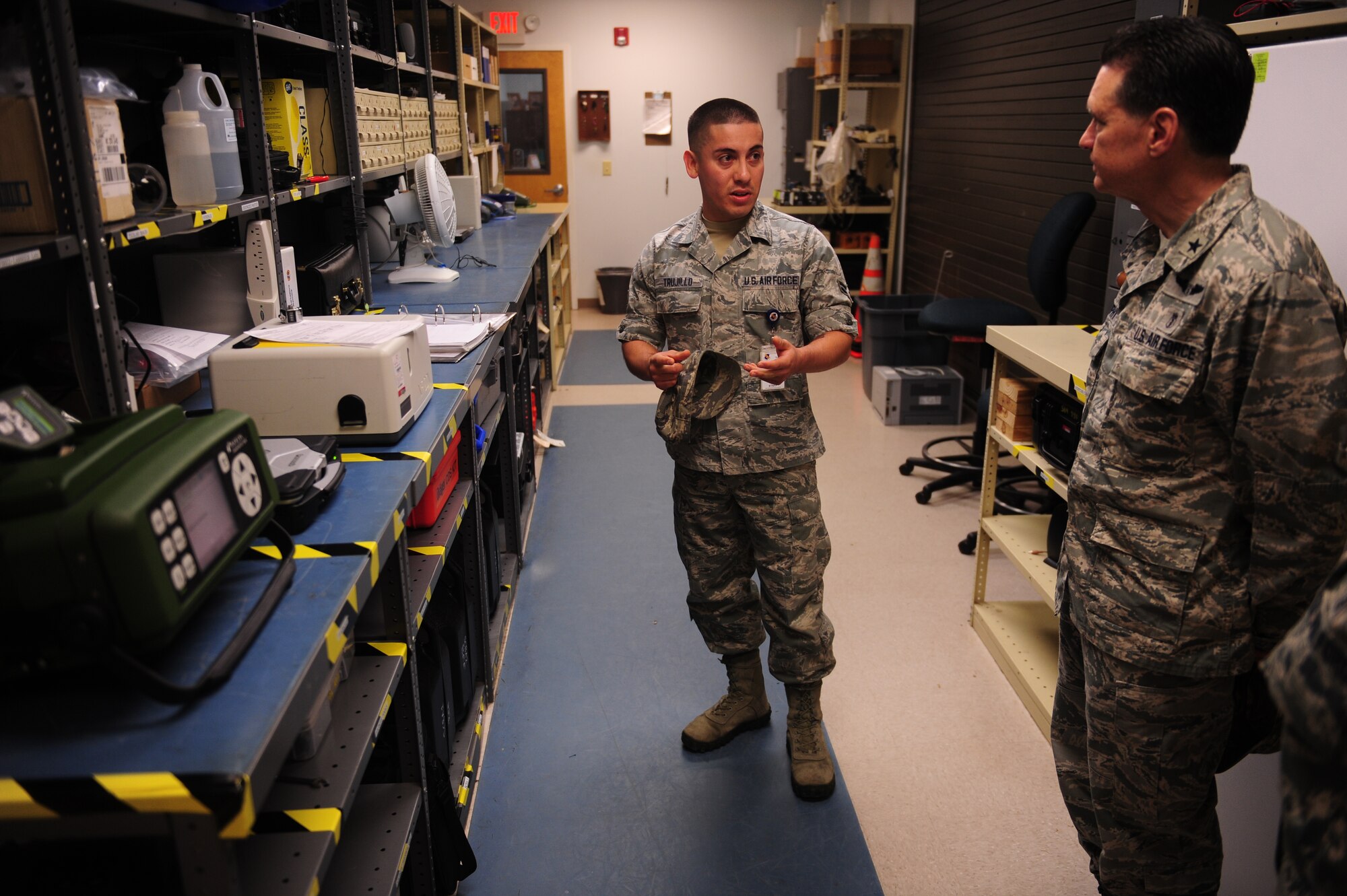 Airman 1st Class Elliseo Trujillo, 4th Aero Medicine Squadron bioenvironmental engineering technician, conducts a brief tour of the bioenvironmental equipment for Brig Gen. (Dr.) Sean Murphy, the command surgeon at Air Combat Command, Oct. 17, 2014, at Seymour Johnson North Carolina. Murphy took time to interact with the Airmen during an orientation tour of the 4th Medical Group and received several briefings on future upgrades to the facility. (U.S. Air Force photo/Airman 1st Class Brittain Crolley)