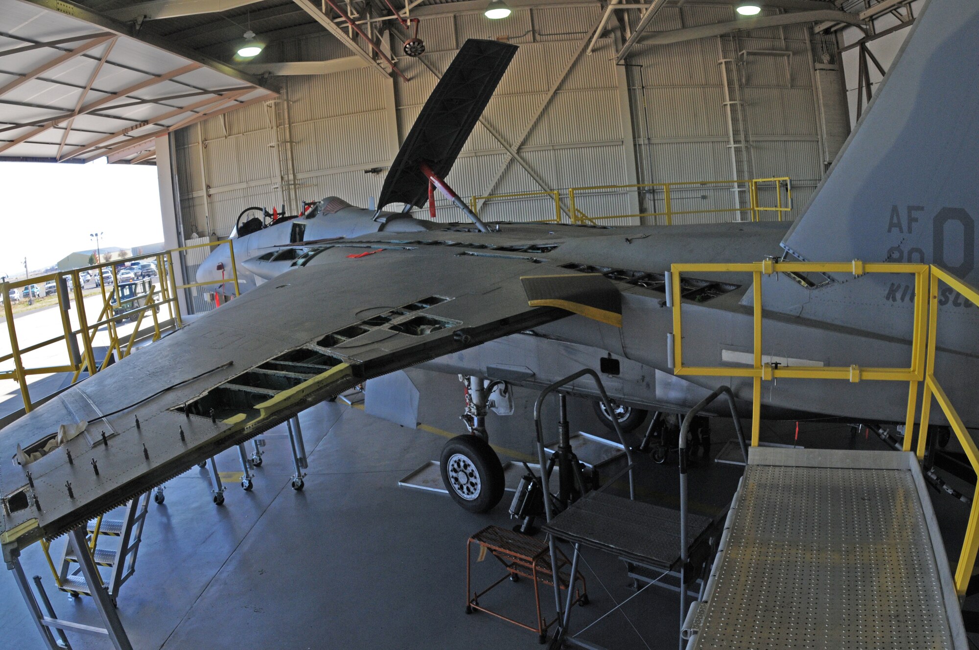 An Oregon Air National Guard F-15 Eagle from the 173rd Fighter Wing is almost unrecognizable as a fighter aircraft with multiple pieces missing from its body while sitting in the hangar at Kingsley Field, in Klamath Falls, Ore. Oct. 16, 2014.  This aircraft is going through phase maintenance where the 173rd FW maintainers closely inspect the aircraft for cracks and other types of damage, verifying that the 30 plus year old aircraft is safe to fly.  (U.S. Air National Guard photo by Master Sgt. Jennifer Shirar/Released)    