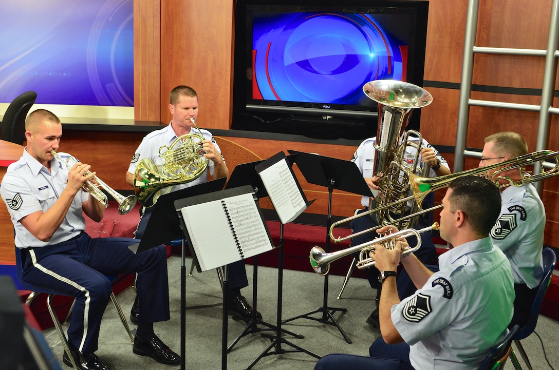 Florida State University alumnus, Chief Master Sgt. Michael Piersol on trombone, leads a Brass Quintet from The U.S. Air Force Band in a performance of the “Washington Post" march on WCTV's “Good Morning Show” live broadcast in Tallahassee, Florida, on Thursday, Oct. 16. (U.S. Air Force photo by Senior Master Sgt. Bob Kamholz/released)