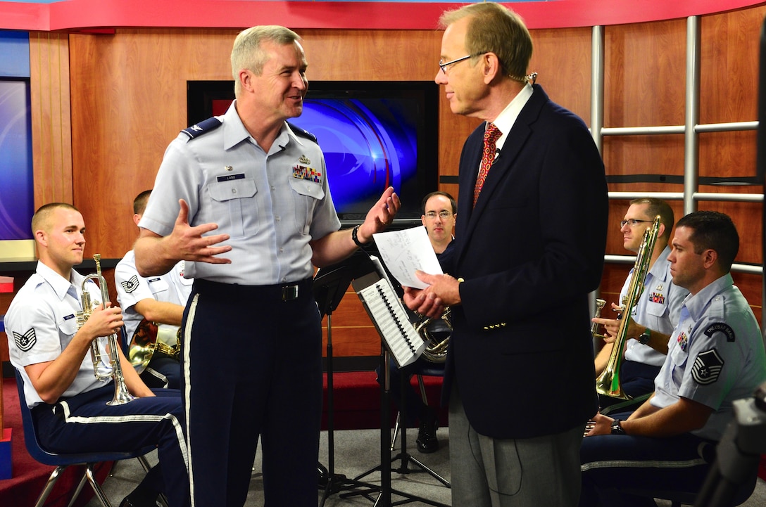 Col. Larry H. Lang, commander and conductor of The U.S. Air Force Band, talks with Art Myers, host of WCTV’s “Good Morning Show,” during a recent interview in Tallahassee, Florida, on Thursday, Oct. 16. (U.S. Air Force photo by Senior Master Sgt. Bob Kamholz/released)