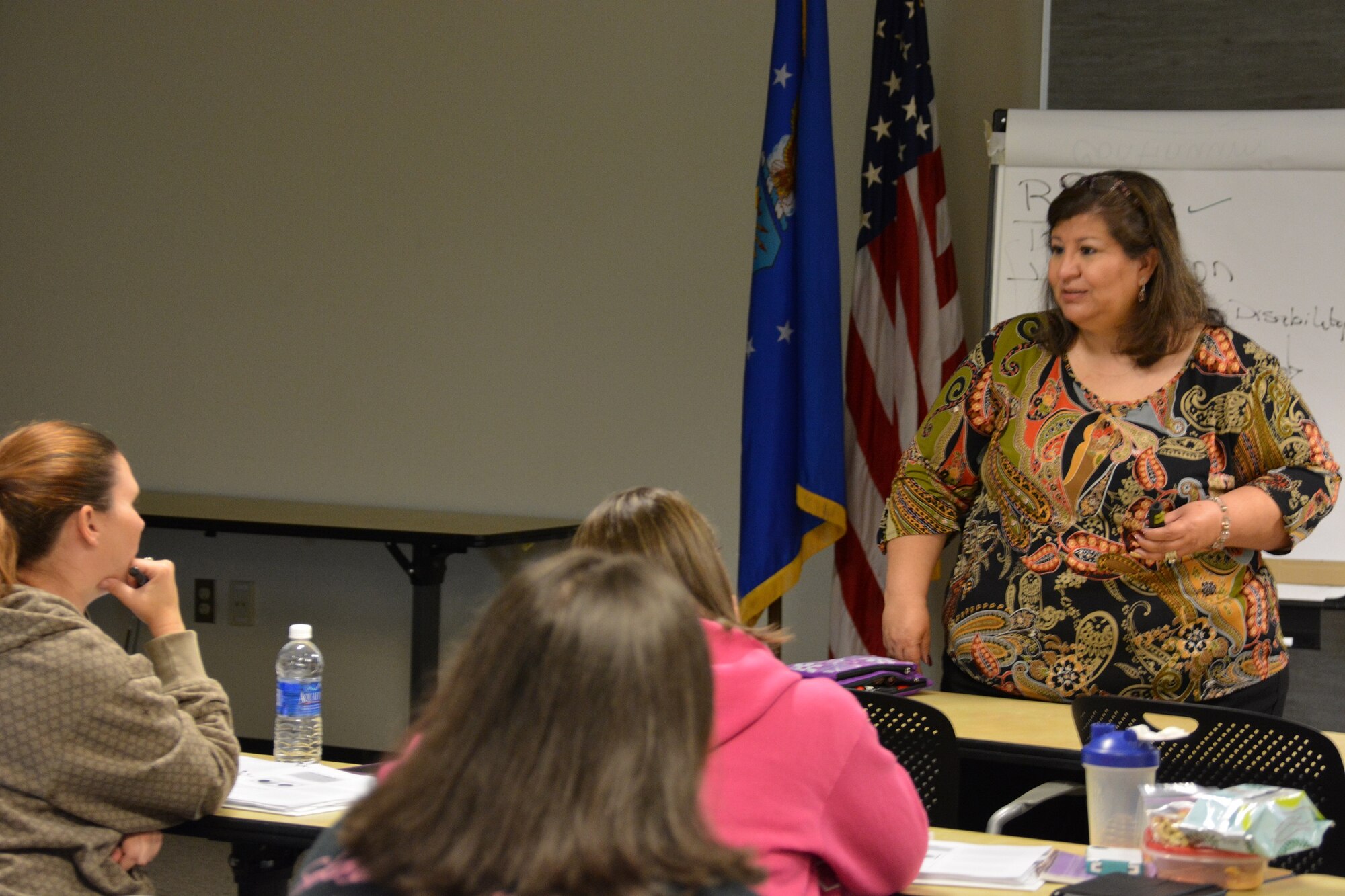 Adriana Martinez, right, Specialized Training of Military Parents training coordinator, listens to a class participant as she demonstrates the importance of active listening during her block of the training Oct. 15, 2014, at Travis Air Force Base. The Airman and Family Readiness Center hosted the two-day event to empower and inform parents with special needs children. (U.S. Air Force by Staff Sgt. Christopher Carranza)