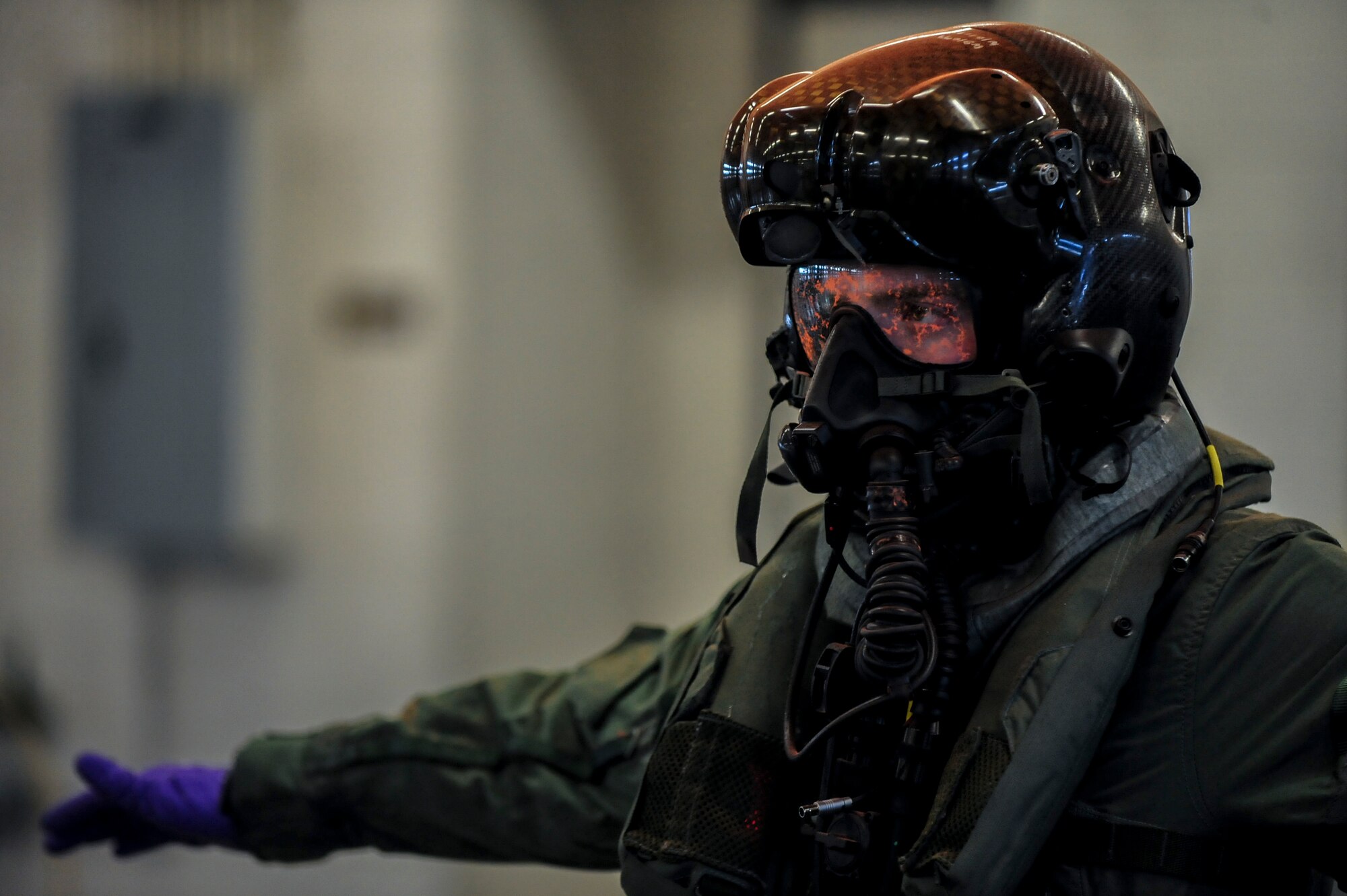 Airman 1st Class Kyle Rogers, an Aircrew Flight Equipment specialist assigned to the 355th Operations Support Squadron at Davis-Monthan Air Force Base, Arizona, goes through decontamination measures during an Air Combat Command Joint Aircrew Flight Equipment evaluation testing Oct. 14, 2014, at Seymour Johnson Air Force Base, North Carolina. Representatives from several bases including Joint Base Langley-Eustis, Ellsworth, Seymour Johnson, Beale, Tinker, Davis-Monthan, Nellis and Hill Air Force Base, were on hand to test current and future flight equipment for every aircraft in the Air Force inventory, including the newest fighter, the military's F-35 Joint Strike Fighter. (U.S. Air Force photo/Airman 1st Class Brittain Crolley)